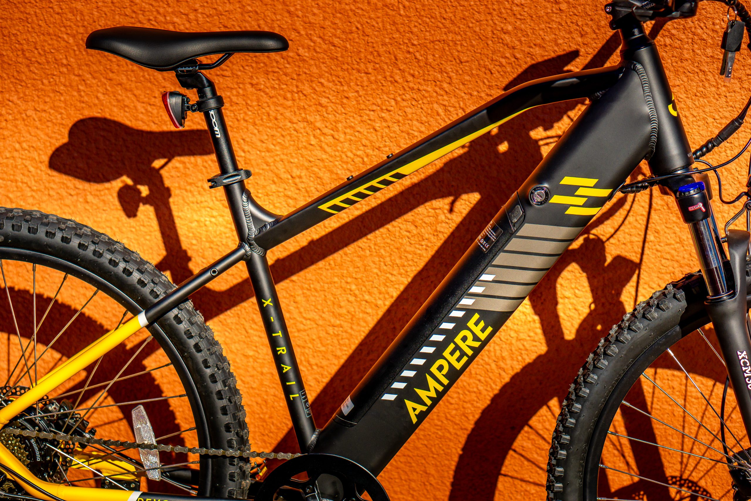 Ampere X-Trail Black Close up with orange background